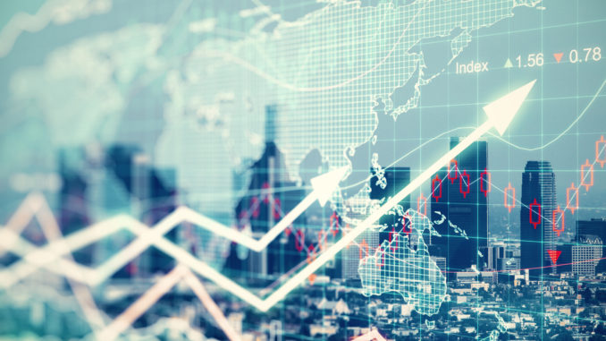 Double explosure with businesss charts and financial district of