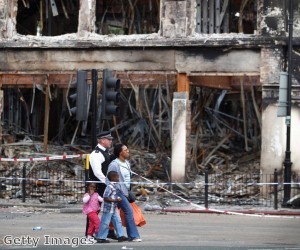 The police authorities and the insurance industry are disputing who may be potentially liable for costs stemming from the riots